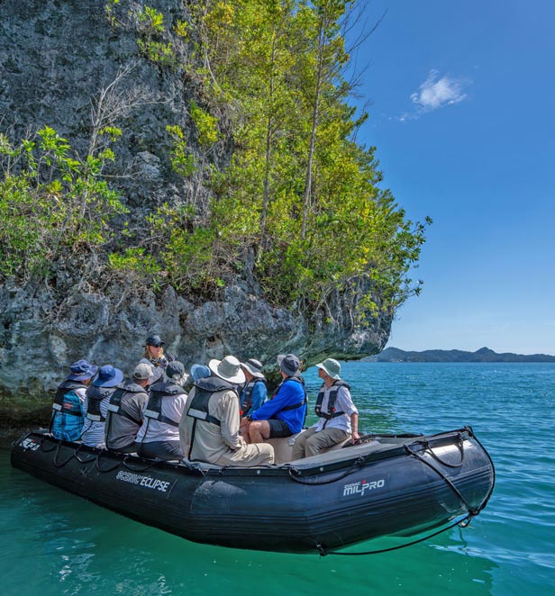 Zodiac cruising Arguni Island, Indonesia
