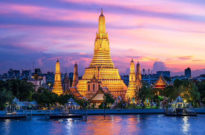 Wat Arun temple lit up at night in Bangkok Thailand