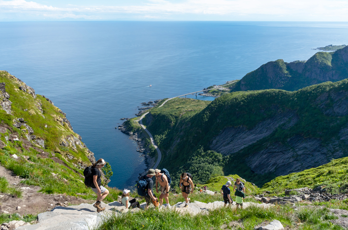 Group of people hiking up Reine on Norway's Lofoten Islands