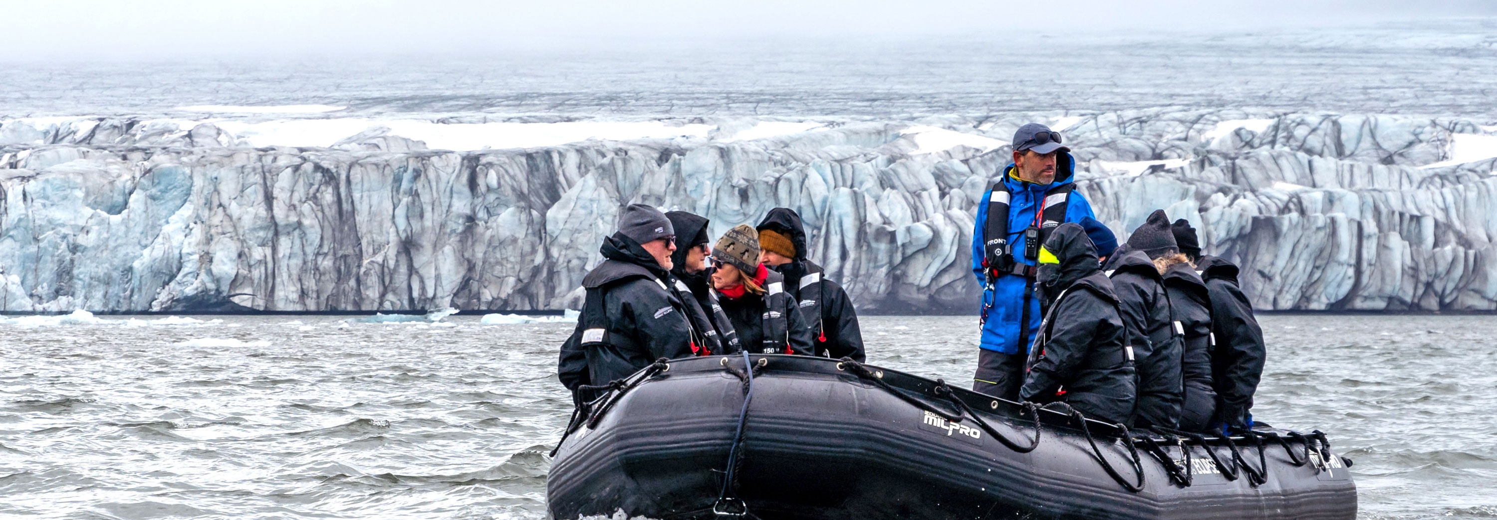 Group of people on Zodiac in Arctic