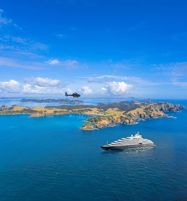 Scenic Eclipse Helicopter flying over Urupukapuka Island, Bay of Islands, New Zealand