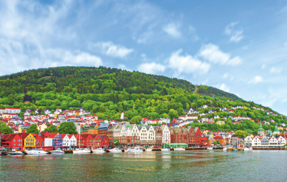 Colourful houses of Norway along the banks of a river