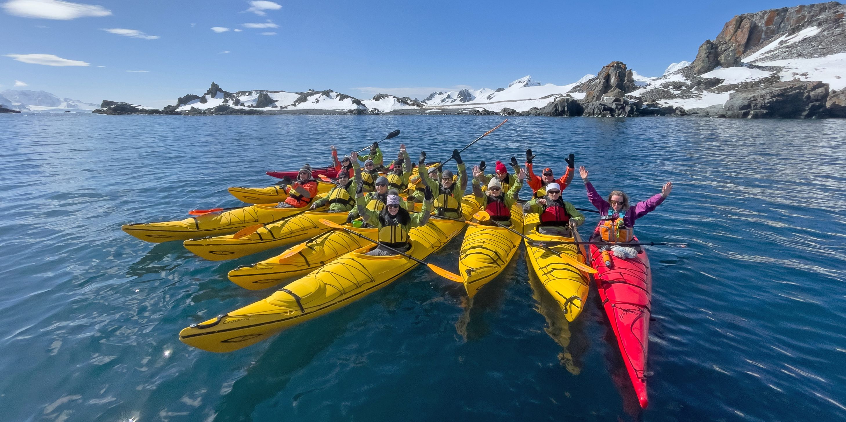 Group of people in sea kayaks in Antarctica